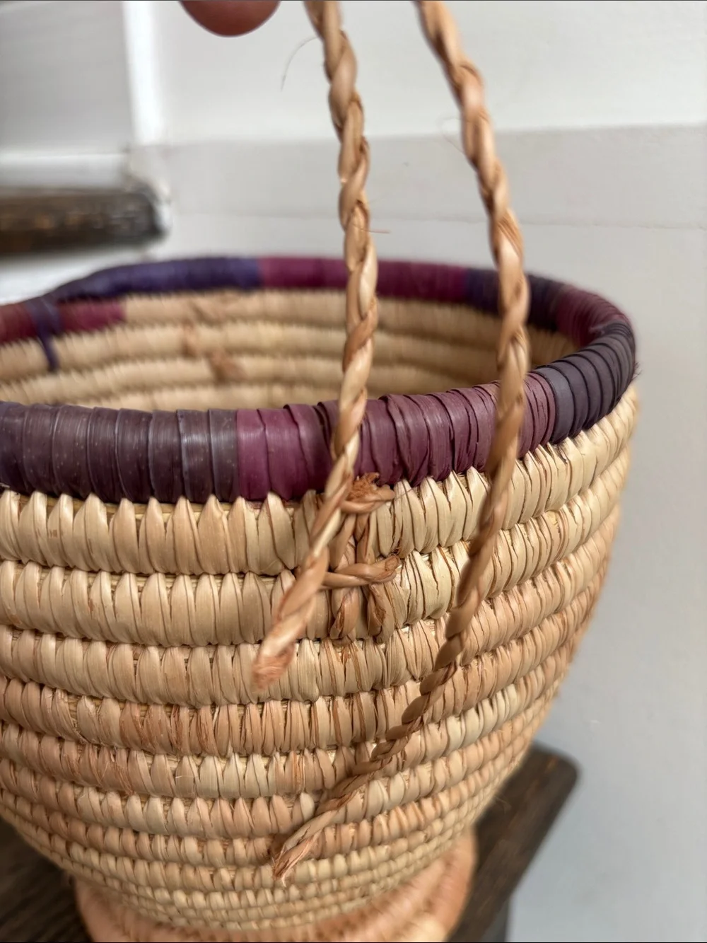 Woven palm leaves? footed basket, purple stripe on rim, 7.5” tall